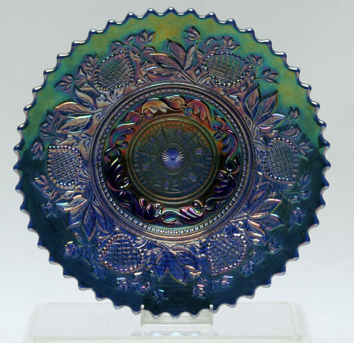 Dugan Fanciful Cobalt Blue Plate: Dugan Fanciful Carnival Glass Cobalt Blue Plate with vivid blue iridescents. Featuring a basketweave exterior pattern. Dugan Glass Co. 8 11/16" D, 1 1/4" HOA. Carolyn Price Collection.