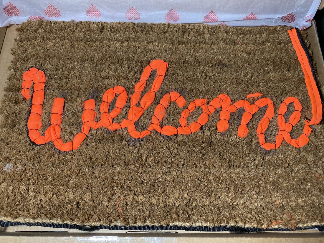 Banksy Welcome Mat Brown: Banksy X Love Welcomes. Welcome Mat, 2019. Life vest fabric on fiber doormat17 x 24 x 1-1/4 inches (43.2 x 61 x 3.2 cm). Produced by Gross Domestic Product and Love Welcomes, London. The mat is hand-s