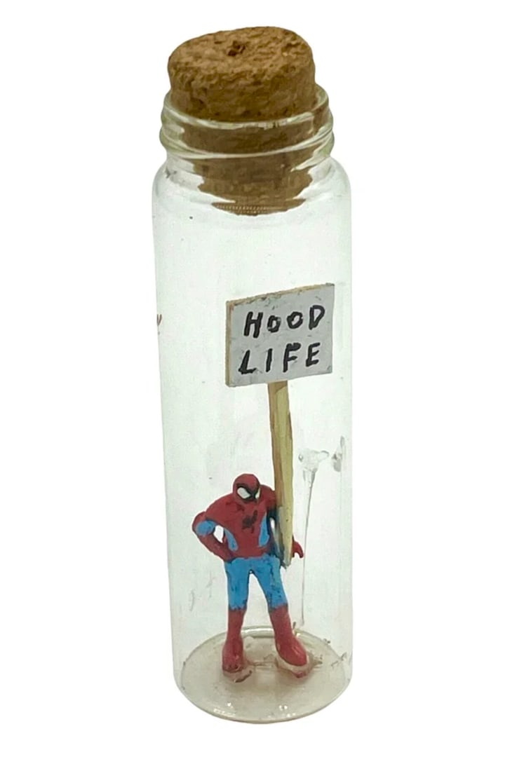 ANTHONY LISTER - MESSAGE IN A BOTTLE (SPIDERMAN) - ORIGINAL: Artist: Anthony Lister (b. 1979) Title: Message In a Bottle (Spiderman), 2044 Original, 1/1. Hand painted plastic figure in sealed glass vessel. 10cm x 3cm x 3cm Signed certificate of authentication i