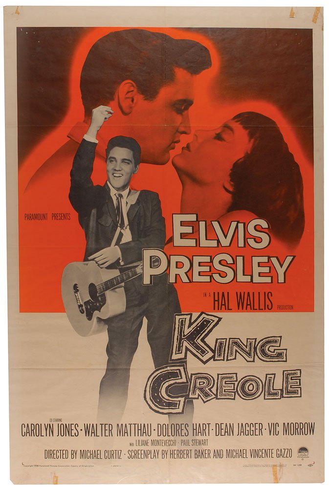 Elvis Presley King of Creole One sheet Movie Poster: Original two-color 27 x 41 one-sheet movie poster for the 1958 film King Creole, starring Elvis Presley and Carolyn Jones. Poster features an image of Presley with his guitar superimposed over one of 
