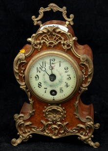 French Mantel Clock: Small Figured Walnut Ormalu Mounted Mantle Clock movement by Lenzkirch. Small crack to dial. Circa 1900. No key, condition unknown. 22cm x 12cm x 7cm.