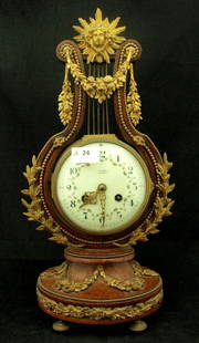 Mantel Clock: 19th Century French walnut lyre shaped mantel clock with pendulum & ormolu mounts, with key - mechanical condition unknown. (47cm)