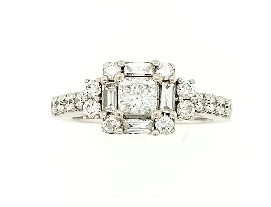 A Diamond Ring: Crafted in 14k white gold featuring (1) round diamonds weighing approximately .50ct with a color of I/J and a clarity of I 1. The ring also features (4) baguettes weighing .20cttw with a color of I/J 