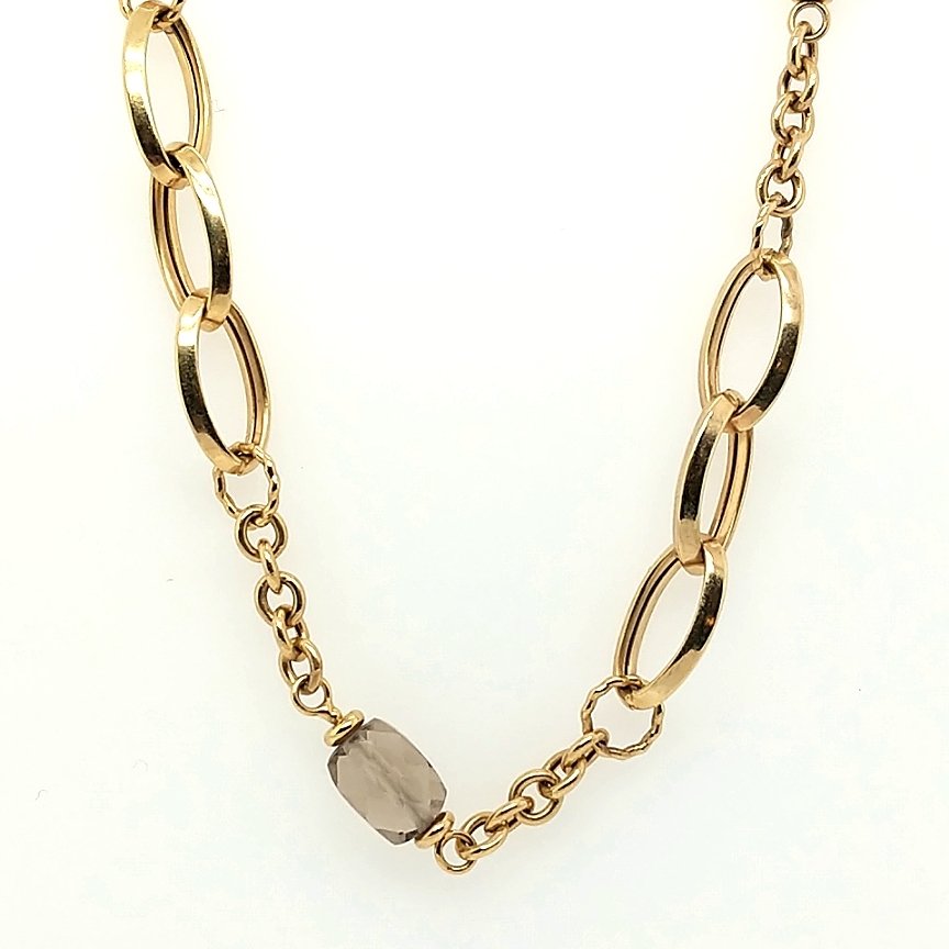 A Gold Necklace: Crafted in 14k yellow gold featuring 4 oval stones. Size: The chain is 16" in length Weight: 8.6dwt