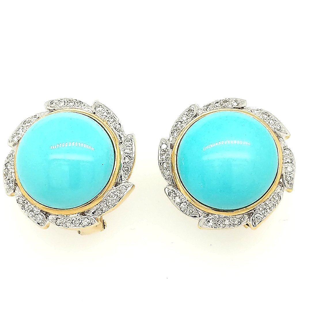 A pair of Turqoiuse & Diamond Earrings: Crafted in 18k yellow gold featuring (2) round turqoiuse measuring 16mm each. There are (64) round diamonds weighing approximately .50cttw with a color of F/G and a clarity of VS2. Size: The earrings 