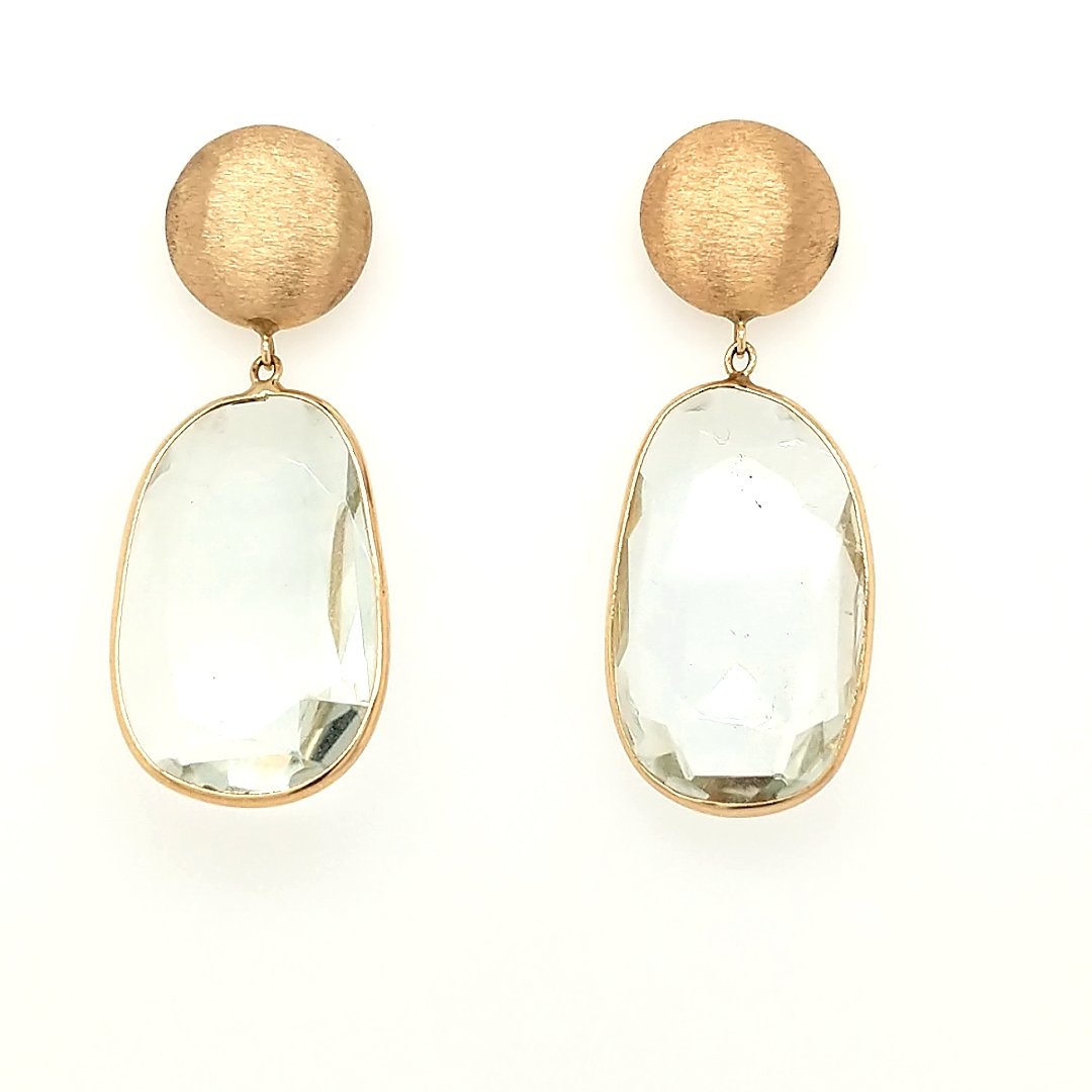 A Pair of Green Amethyst Earrings: Crafted in 14k yelow gold featuring (2) oval shaped Green amethysts measuring 1" x 1/2" Size: 1.5" from top to bottom Weight: 3.7dwt