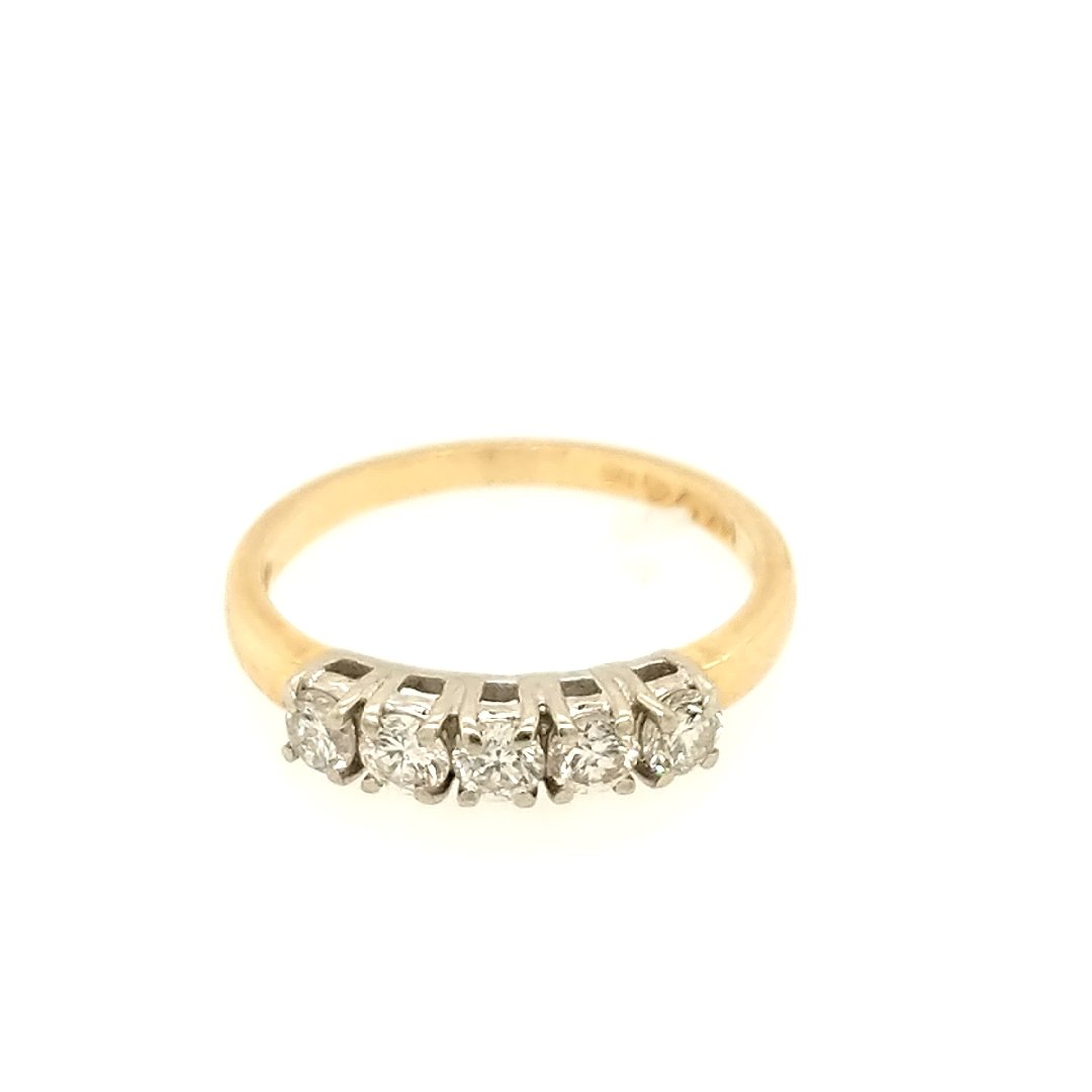 A Diamond Band: Crafted in 14k yellow gold featuring (5) round diamonds weighing .50cttw with a color of H and a clarity of SI3 Size: 6.25 ring size Weight: 1.4dwt