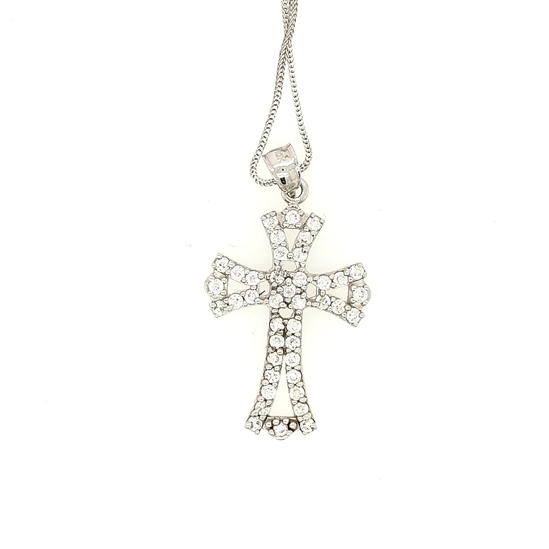 A Cross Pendant: Crafted in 10k white gold. The diamonds in the cross are all CZ. The cross measures 1" x 3/4" Size: 18" chain Weight: 2.2dwt