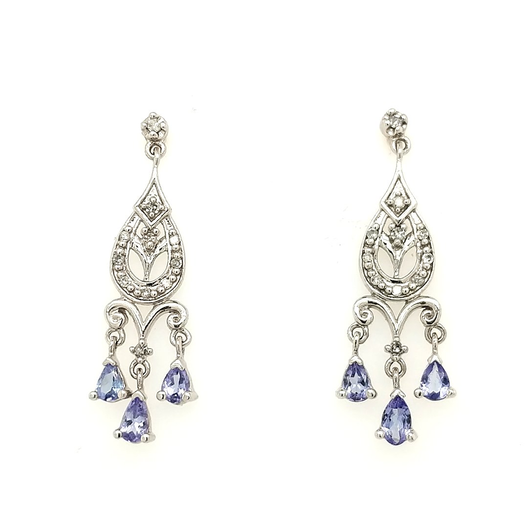 A Pair Of Sapphire & Diamond Earrings: Crafted in 14k white gold featuring (6) pear shaped sapphires weighing approxiamtely 1.0ct and (22) round diamonds weighing approximately .25cttw. Size: 1 1/2" from top to bottom Weight: 2.2dwt