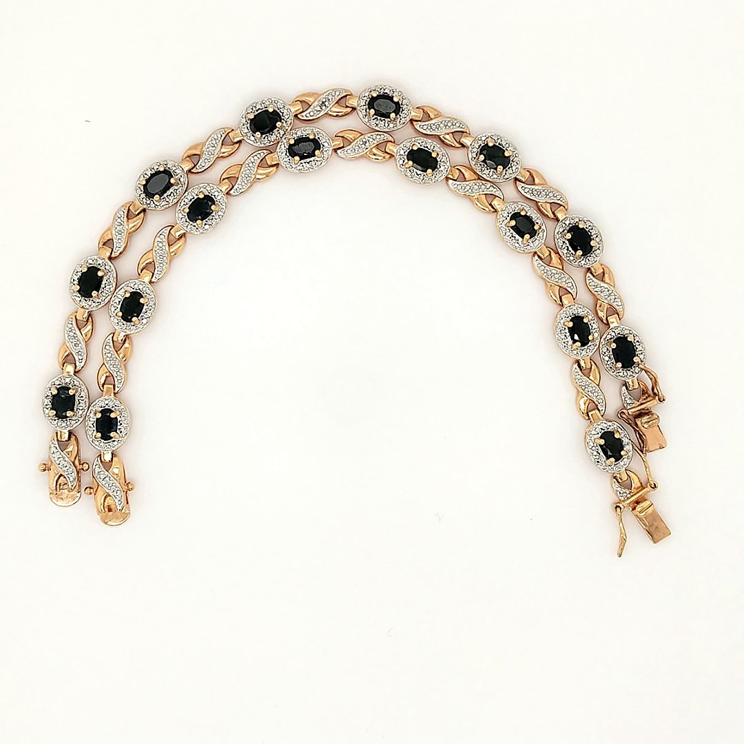 Gold Vermeil & sapphire Necklace: A gold Vermiel sapphire necklace that can be converted into two bracelets. Size: 14" necklace or 2 7" bracelets