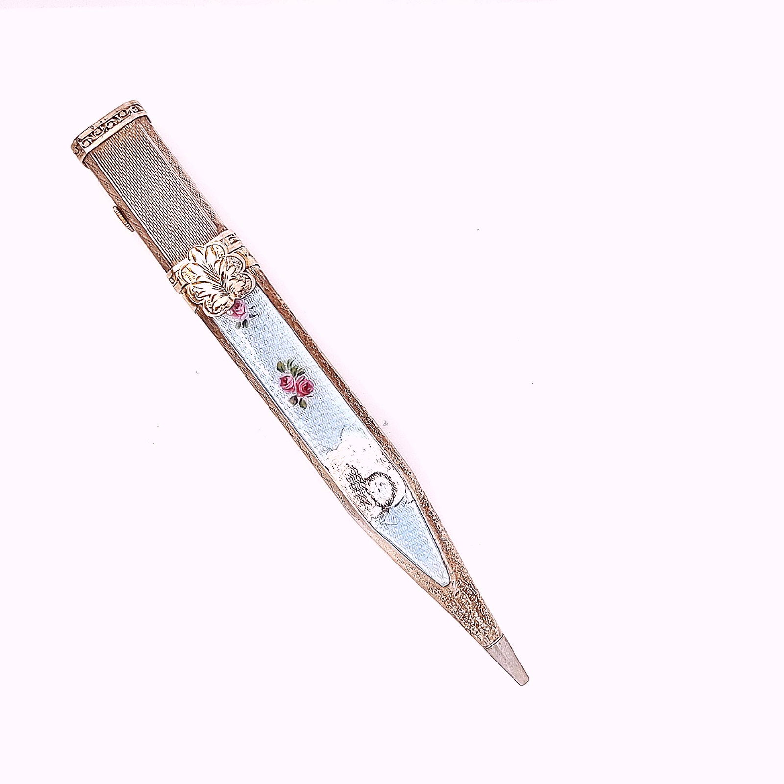 Bucherer Mechanical Pencil Watch: Crafted in sterling silver the Bucherer clock pencil has floral enamel inlay and it weighs 17.8dwt and measures 4 1/2 inches x 1/4 inch.