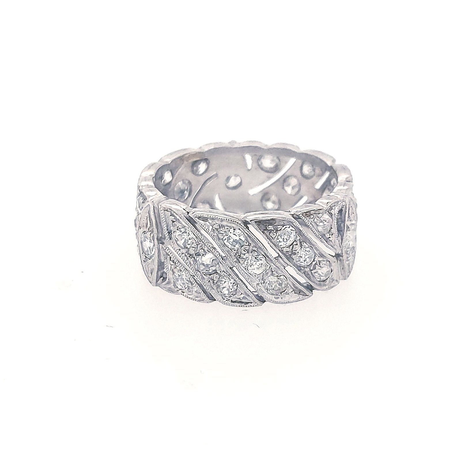 Diamond Band: Crafted in 18k white gold featuring (36) round diamonds weighing .36cttw. The ring is a size 6 1/2 and weighs 3.9dwt