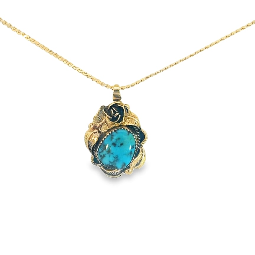 Turquoise Pendant: Crafted in 14k yellow gold with (1) oval shaped turquoise. The pendant measures 1 1/4in x 3/4in and the necklace is 16in in length and weighs 6.2dwt