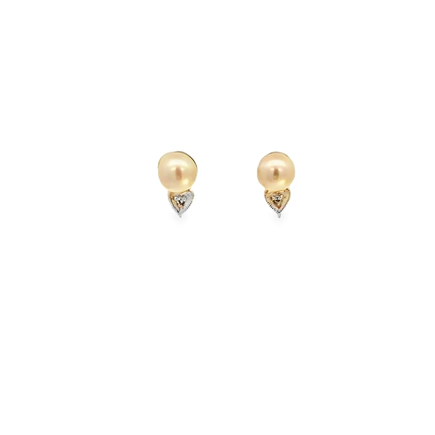 Pearl Earrings: Crafted in 14k white gold featuring (2) round pearls measuring 6 1/2mm. The earrings weigh 1.2dwt