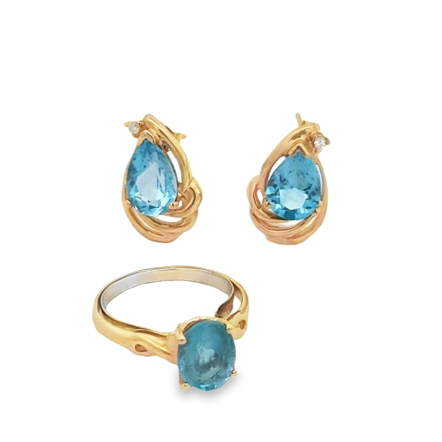 Topaz Ring and Earrings: The ring is crafted in 14k yellow gold featuring (1) oval blue topaz measuring 9mm x 7.1mm x 5mm and weighing approximately 2.17ct. The ring is a size 7 3/4 and weighs 1.8dwt. The earrings are crafted
