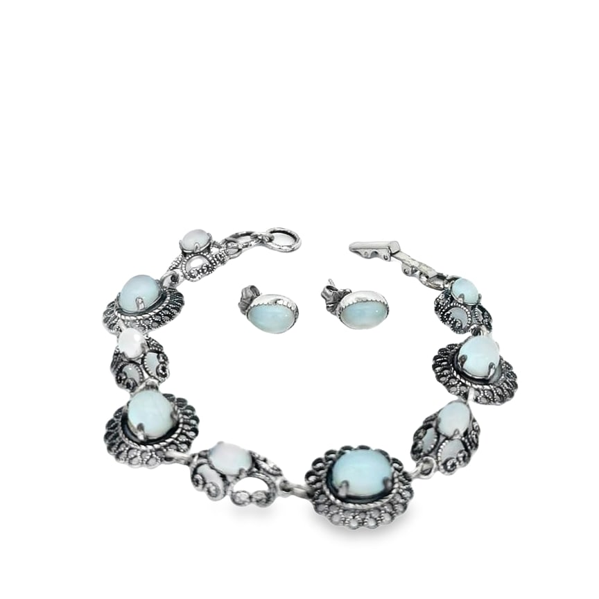Sterling and Opal Bracelet and Earrings: The bracelet is crafted in sterling silver with (9) cabochon opals and measures 7in. The earrings are crafted in sterling silver with (2) oval opals and the total weight is 7.9dwt