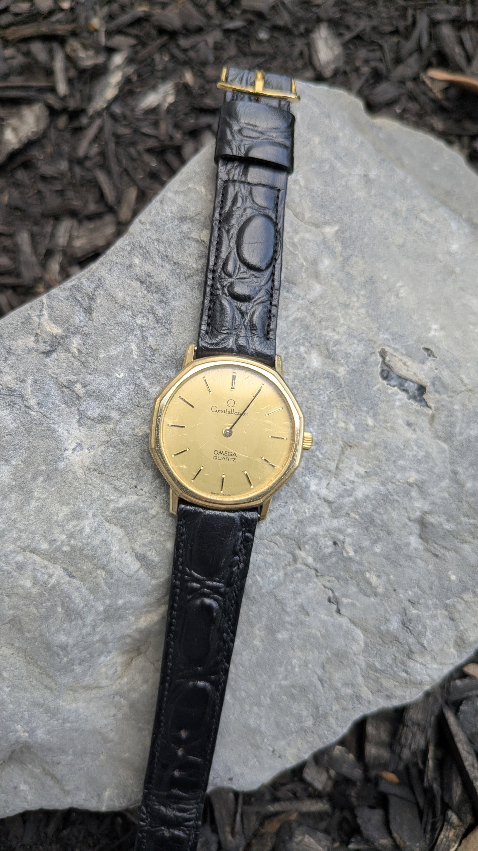 Vintage Mens Omega Constellation Watch: Circa 1977, the watch has a quartz movement with a black alligator band