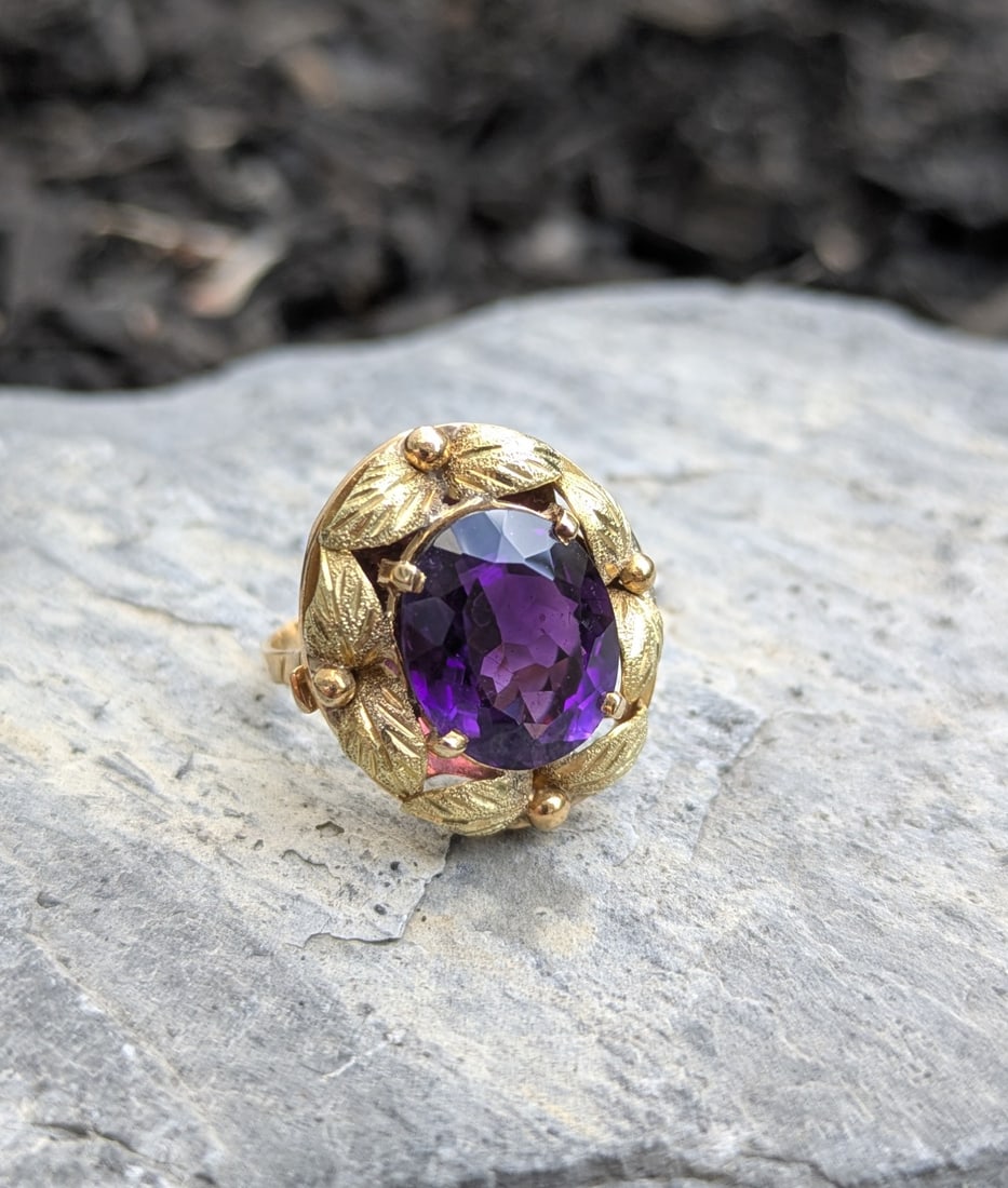 Vintage Amethyst Ring: Crafted in 14k & 18k yellow gold, the amethyst measures 12.2mm x 10.5mm x 5.7mm and weighs approximately 3.60cttw. The ring is a size 6 and weighs 4.2dwt