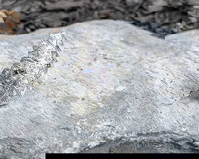 Edwardian Diamond and Sapphire Ring: Crafted in platinum featuring (14) old mine cut diamonds weighing approximately 1.0cttw. There are also (3) square shaped sapphires. The ring is a size 7 and weighs 3.3dwt