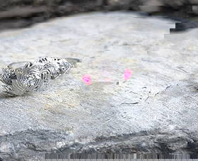 Edwardian Diamond and Ruby Ring: Crafted in 18k white gold featuring (1) round diamond weighing approximately .12ct. The ring is a size 7 1/2 and weighs 1.5dwt