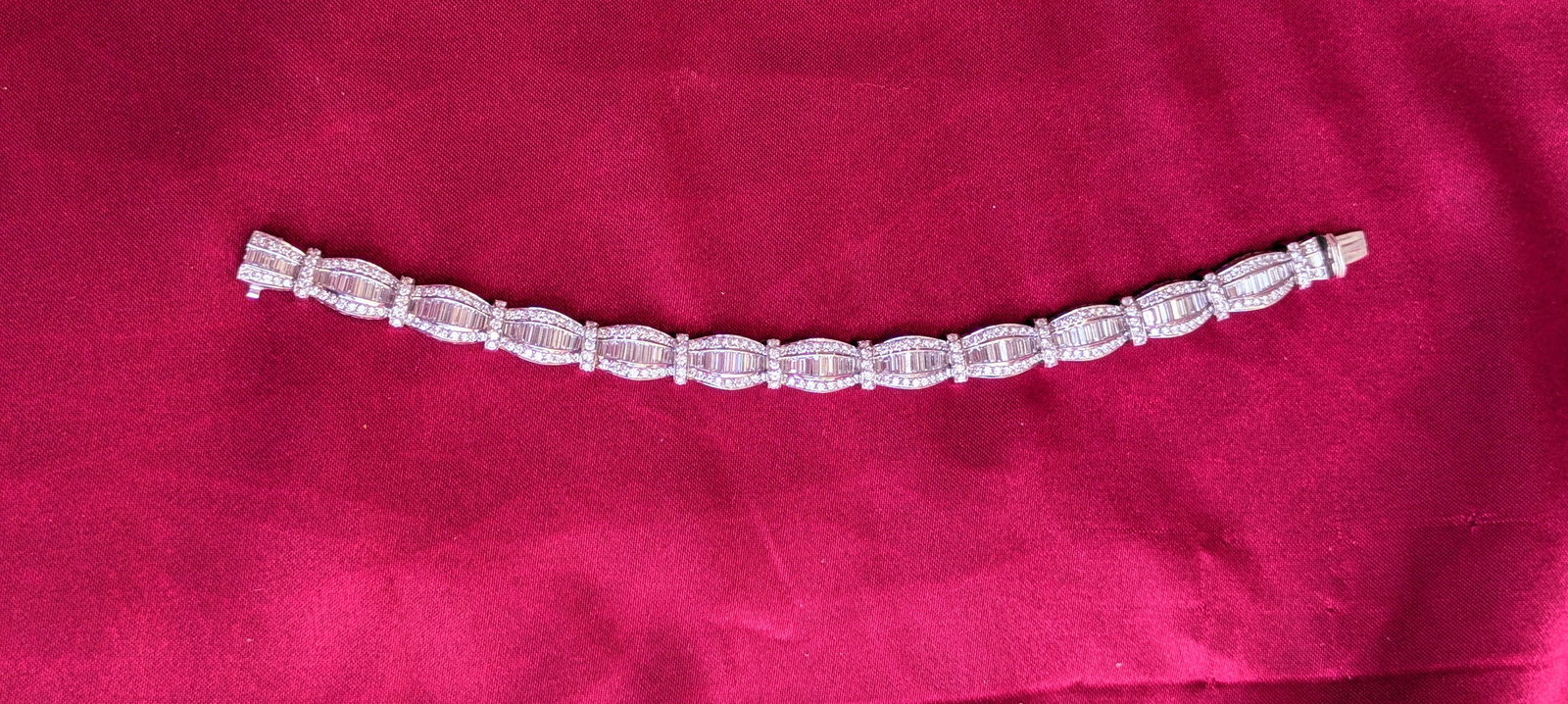 Vintage Diamond Bracelet: Crafted in 18k white gold featuring (121) tapered baguettes weighing approximately 3.87cttw and (208) round diamonds weighing approximately 2.10cttw. All diamonds have a G/H in color and SI1-SI2 in cl