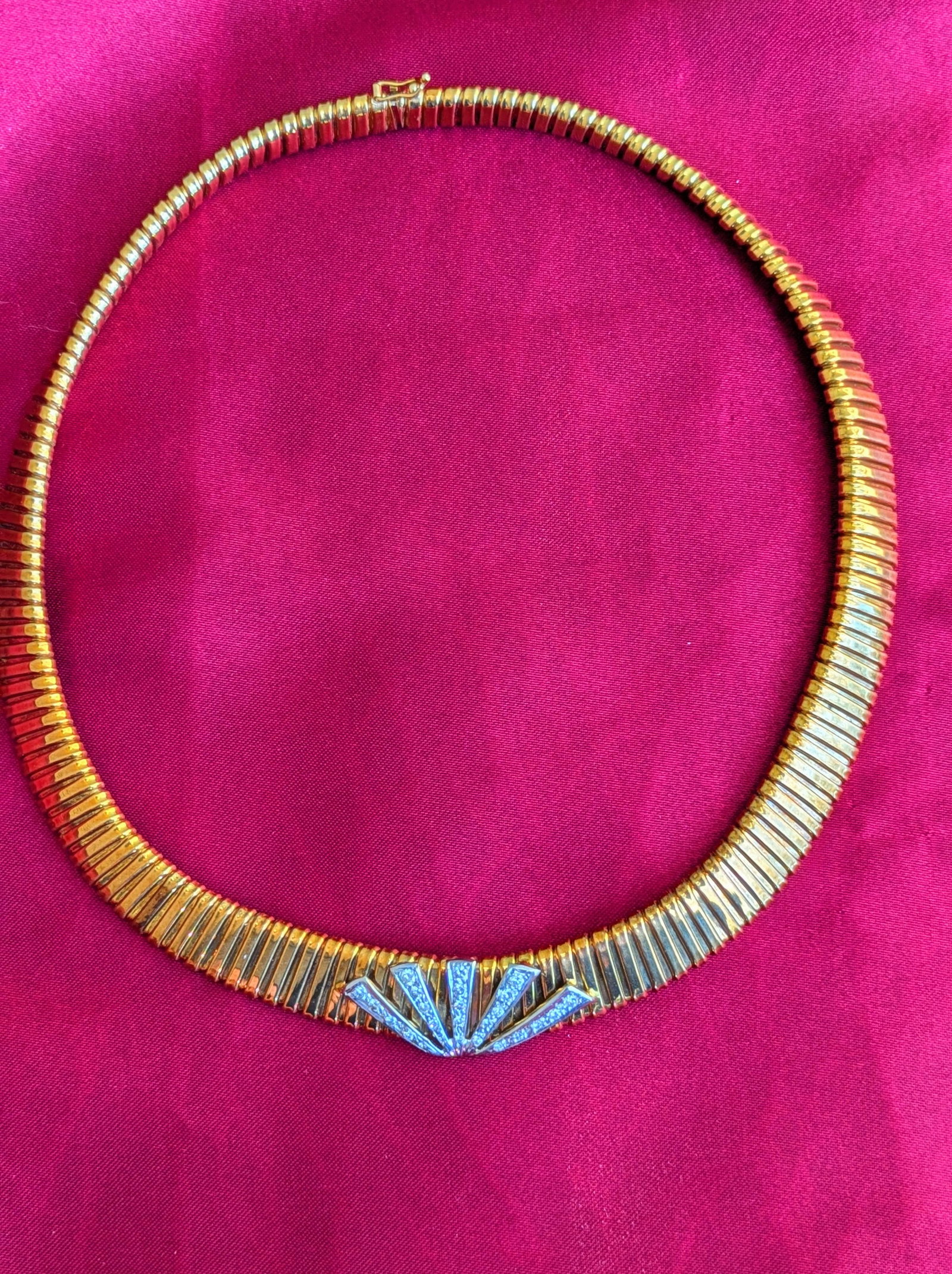 Italian Gold and Diamond Necklace: Crafted in 14k yellow gold featuring (25) round diamonds weighing approximately .50cttw. The diamonds are set in white gold and the necklace is 16in in length and weighs 39.6dwt. It is stamped Italy 1