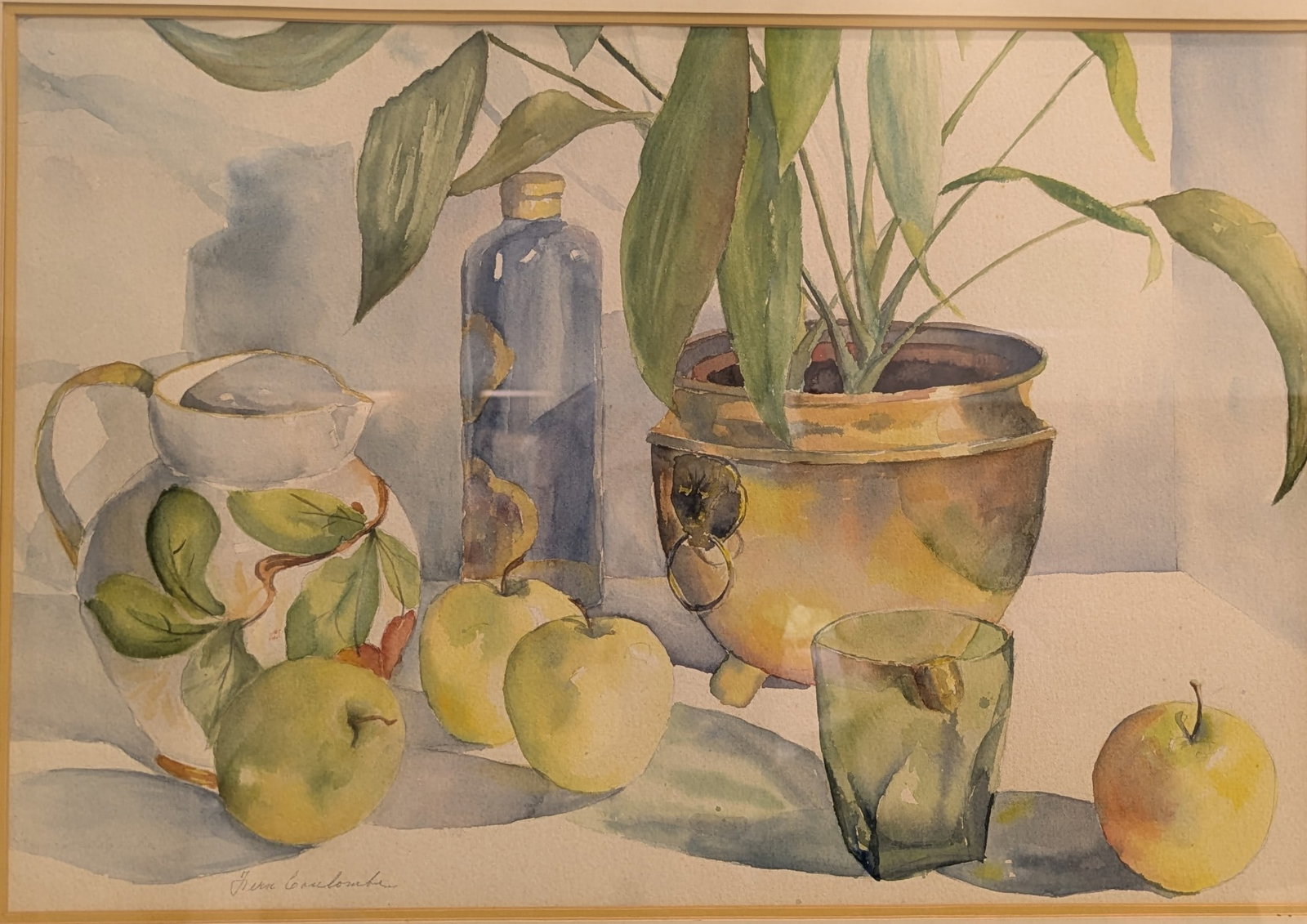 Fern Coulombe “Still Life with Fruit and Pots": By Fern Coulombe, the painting depicts a still life of apples, a drinking glass, a glass jar, a plant and a vase. The painting is watercolor on paper and is signed on the lower left. The painting is 1