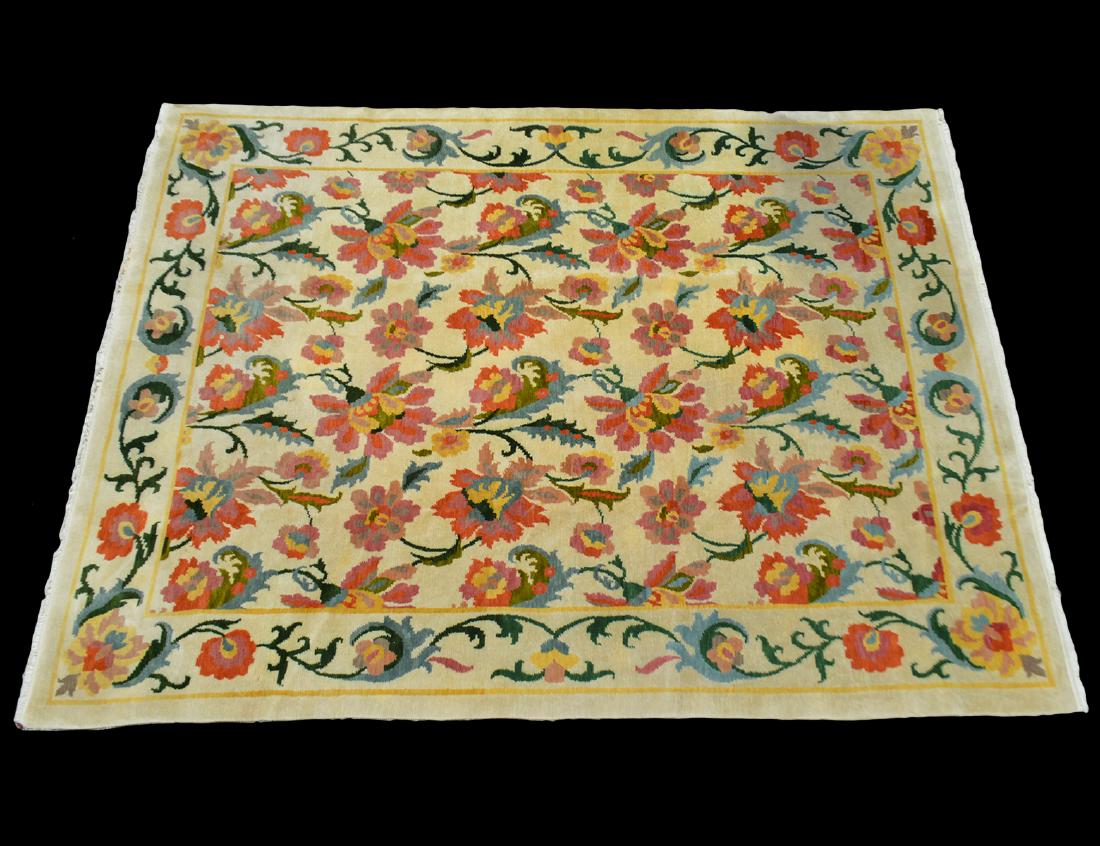 EDWARD FIELDS CONTEMPORARY FLORAL CARPET: Modern. Labeled. The all over cream field with colorful blossoming trailing vines. Measuring 8’10” by 6’11”. (500/700)