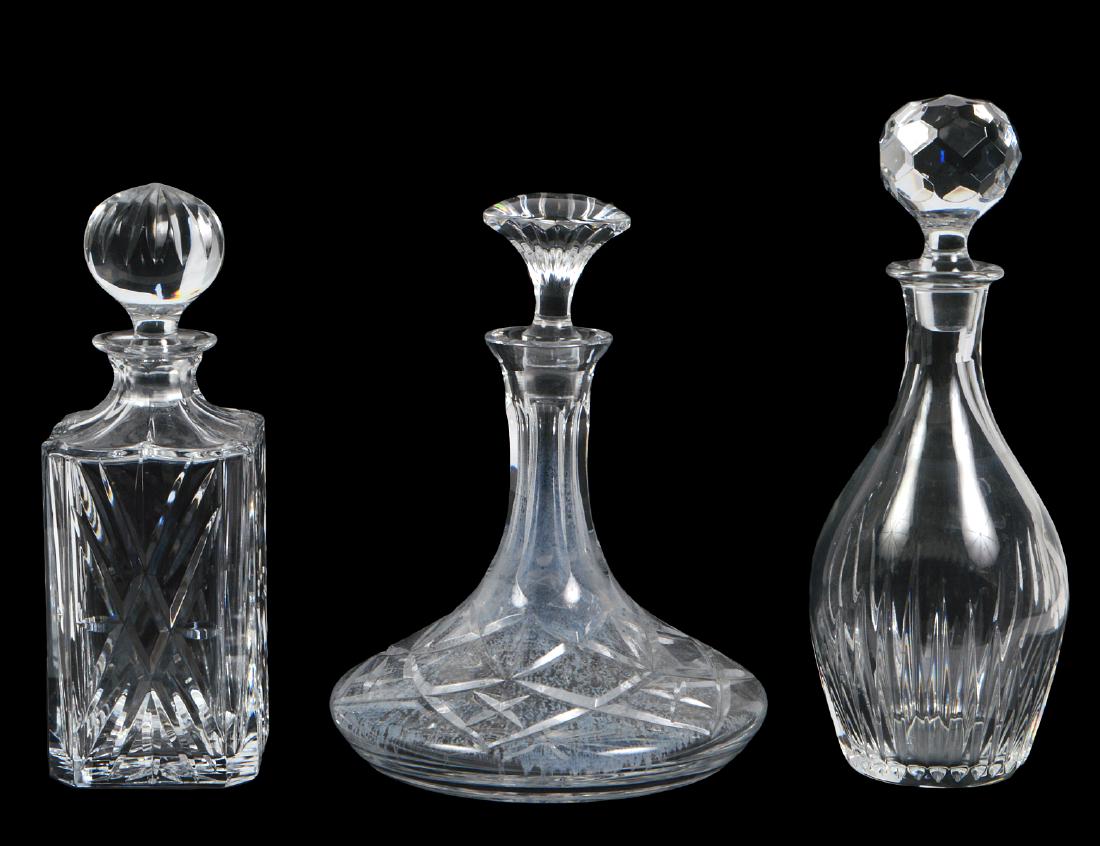 THREE COLORLESS CUT GLASS DECANTERS (1 of 3)