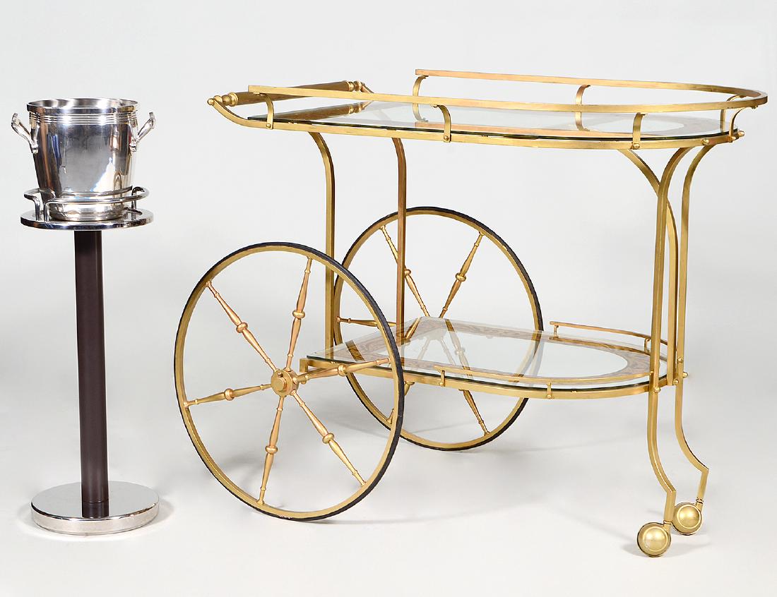 BRASS AND EGLOMISE GLASS DRINKS CART: Possibly Italian. Together with a chromed metal wine bucket of stand. (2 pcs) (Cond: good) (150/200). Provenance: Property from The Estate of Susanne Robbins, Boca Raton, FL.