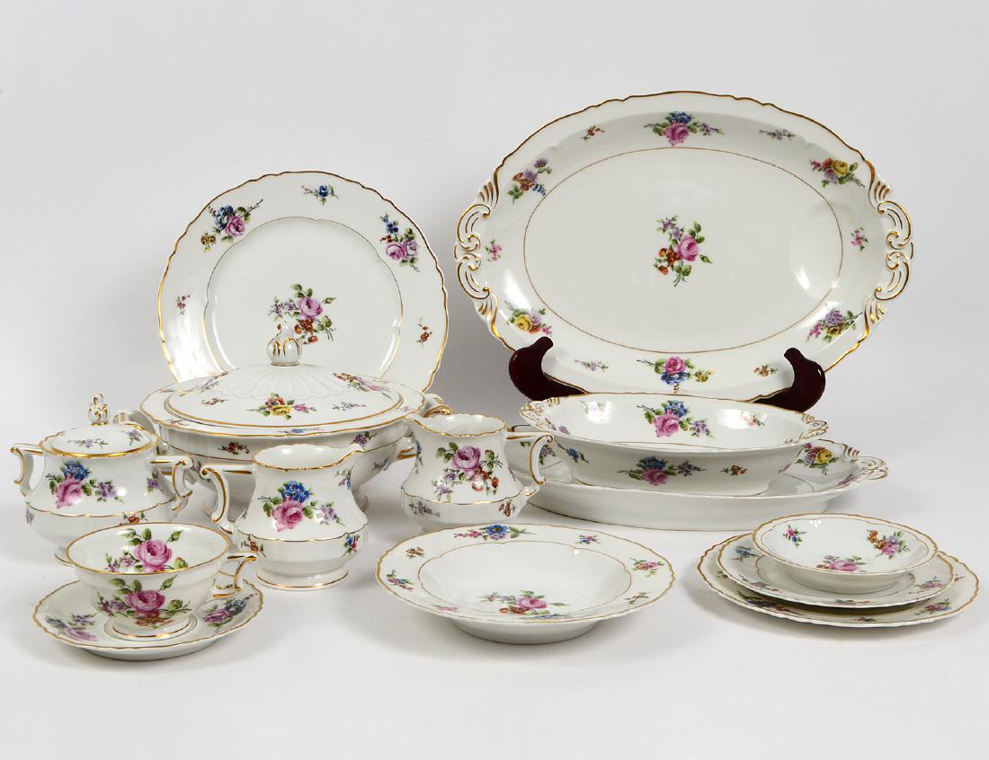 FRENCH PORCELAIN 135 PIECE DINNER SERVICE: Early 20th Century. In the "Chantilly" pattern. Marked on the underside. Decorated with floral sprays with gilt highlights. Comprising: 20 dinner plates, 20 luncheon plates, 20 salad plates, 12 soup b