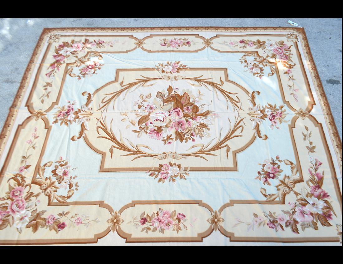 AUBUSSON CARPET: Modern. Worked in a typical overall pattern of foliage and scrolls, with medallions. Measures 12ft. 8 in. by 15 ft 6in. (Cond: good)