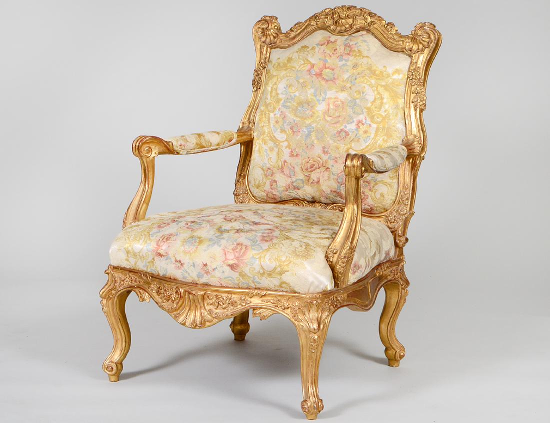 CONTINENTAL ROCOCO STYLE GILTWOOD ARMCHAIR: The shaped back elaborately carved with shells and foliage, the scrolled arms, serpentine seat and cabriole legs, similarly carved. Height back to floor 37". Width of seat 25". (Cond: good)