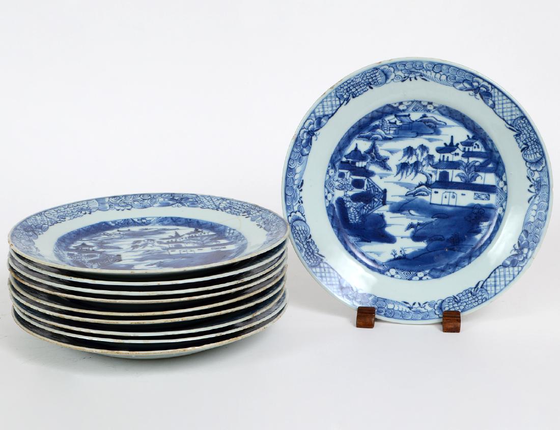 TEN CHINESE-EXPORT BLUE AND WHITE PORCELAIN PLATES: Canton. 19th Century. Each decorated, painted with a tiered landscape dotted with pavilions. Diameter 9". (Cond: minor variations on some)
