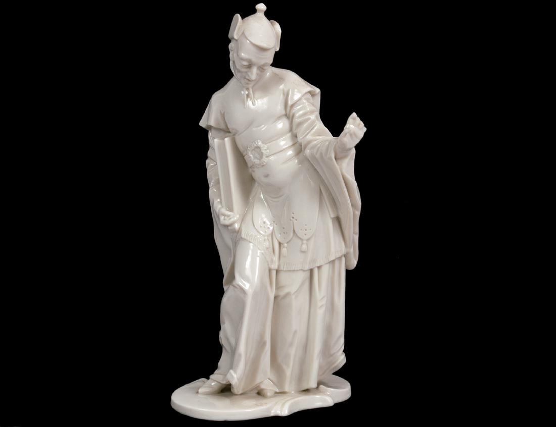 TWO BLANC DE CHINE PORCELAIN FIGURES, CHINAMAN & VENUS: Both 19th Century. The first, Meissen, incised crossed swords, with numerous numerals. The elegantly modeled figure in flowing robes and hat. The second Vienna, the underside with scepter in under gla