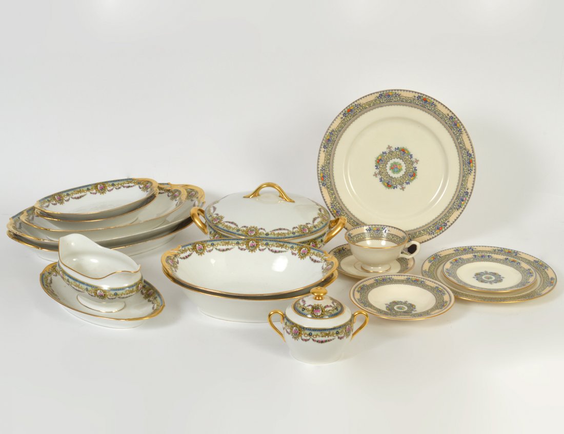 GROUP OF LIMOGES AND LENOX PORCELAIN DINNERWARE: Early 20th Century. In the Â“AmouretteÂ” pattern seven large oval serving bowls and platters, a covered circular tureen, a footed vegetable boat,and a covered sugar bowl. and in the Â“Festiva