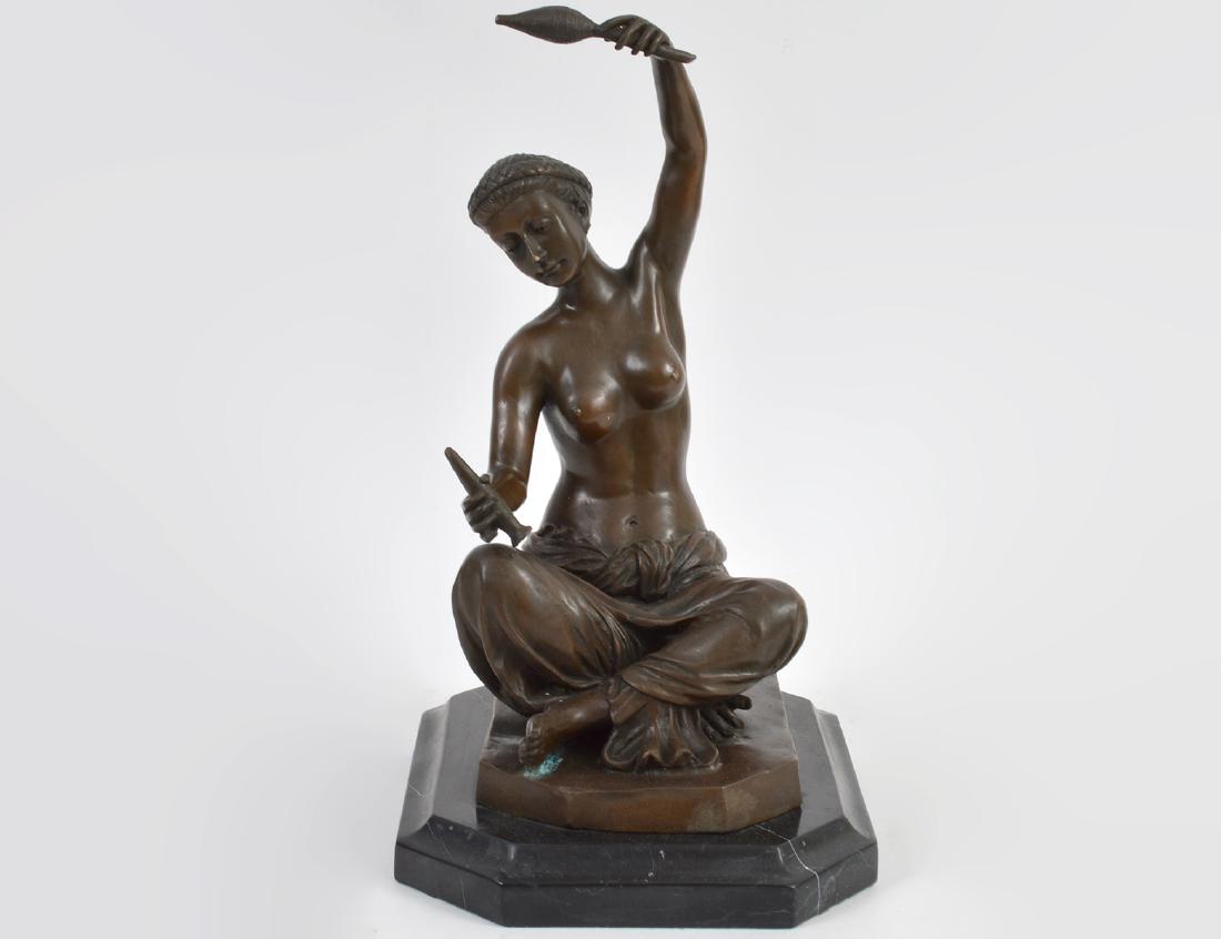FRENCH PATINATED BRONZE OF A FEMALE TEXTILE SPINNER: Early 20th Century. Signed Jean Patou (1880-1936), and with reduction seal. The scantily clad Eastern female seated upon a bronze base, with marble plinth. Height 13”. Overall 14 ½”. 