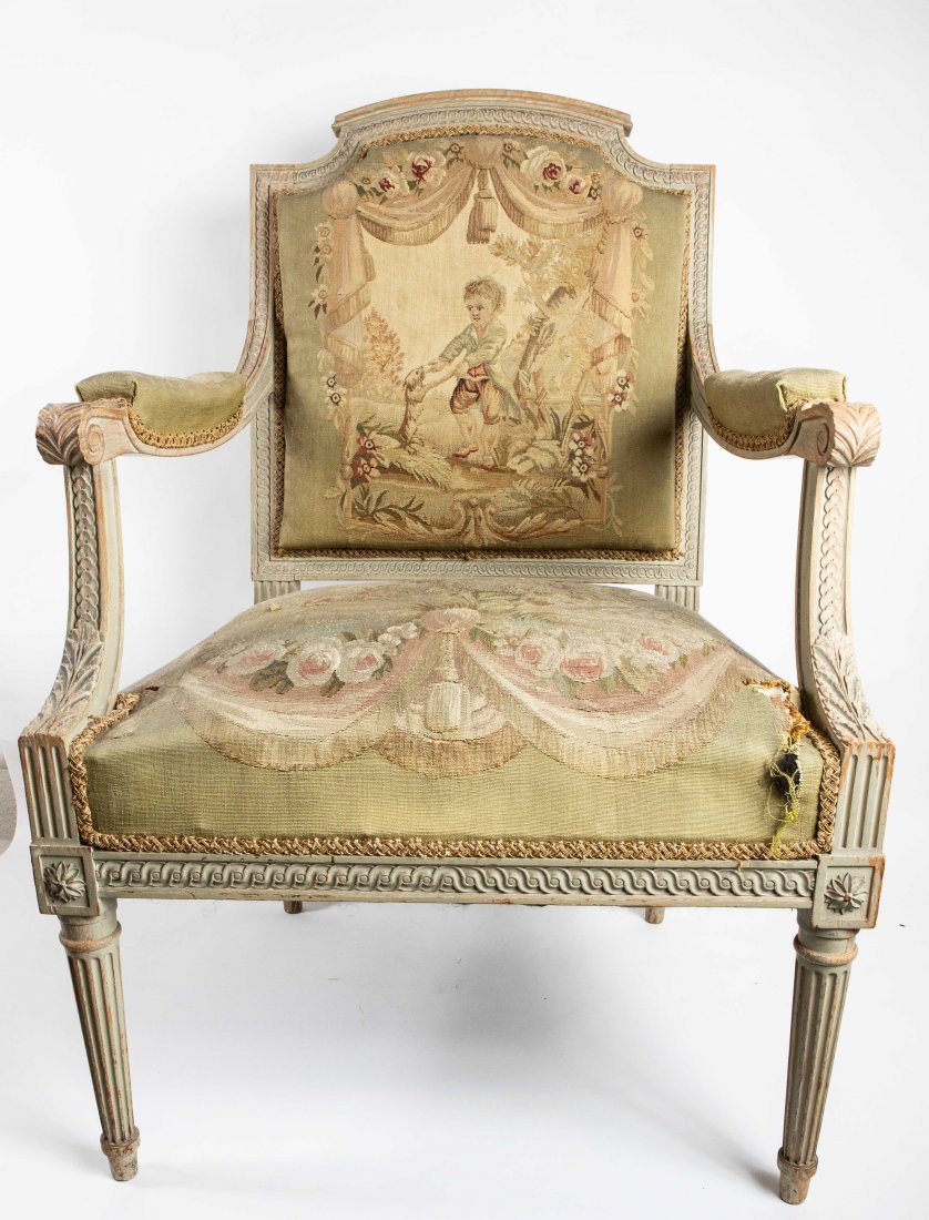 PAIR OF LOUIS XVI STYLE FAUTEUILS A LA REINE: Late 19th/Early 20th Century. Carved square backs with the conforming seats on circular tapered fluted legs, upholstered in Aubusson tapestry. 19 in. seat height. 37 in. high. 24 1/2 in. wide.(Cond: g