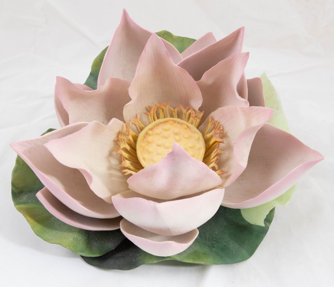BOEHM PORCELAIN PINK LOTUS GROUP: Marked and numbered 113. made in England 1970. Signed in marker by Helen Boehm. Height 4 1/2 in. Width 9 1/2 in. (Cond: repair to one leaf)