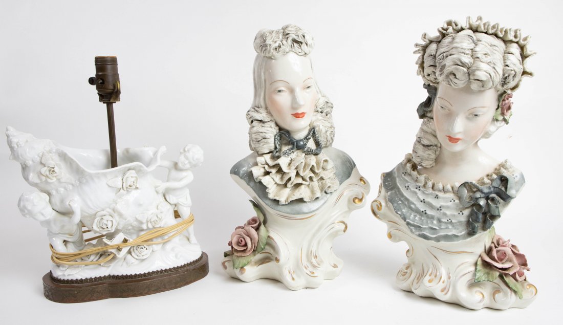 PAIR OF CONTINENTAL PORCELAIN BUSTS OF WOMEN: Marked Corday, numbered 8038 and 8039. Each in elaborate attire, with coiffed hair and ribbons, the scrolled Rococo style bases with gilt highlights. Together with a Continental blanc de chine porcela