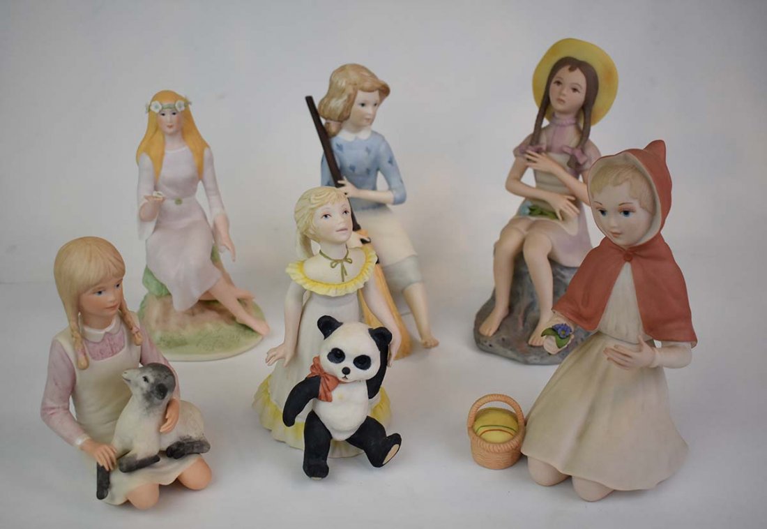 THREE CYBIS & THREE ISPANKY YOUNG GIRLS: All marked. Each in a differing pose, some with an animal, one representing “Little Red Riding Hood”. Heights from 9 to 5 ¾ in. (Cond: appear to be good, but SOLD AS IS)