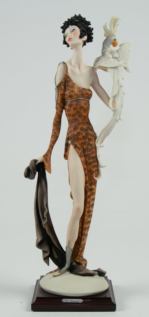 GIUSEPPE ARMANI PORCELAIN SAUCY PARROT: The base marked with Capodimonte crowned N in blue. Limited edition, #1610C. Depicting an elegantly dressed lady, a parrot upon her left arm. Height 19 ¼ in. (Cond: good)