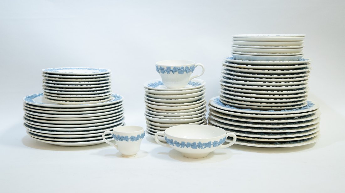 WEDGWOOD QUEENSWARE NINTY-FIVE PC PORCELAIN SERVICE: First Half 20th Century. Marked on the underside. In the Eturia pattern, with a band of raised blue foliage on a white ground. Comprising: 8 dinner plates, 12 luncheon plates, 12 shallow soup bowls, 1