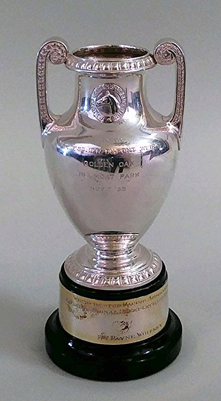AMERICAN STERLING SILVER EQUESTRIAN TROPHY: Dominick & Haff, 1939. Engraved, Â“WON BY / MRS. ESTER DUPONT WEIRÂ’S / GOLDEN OAK / BELMONT PARK / NOV. 7 '59. The urn-shaped vessel with two upward scrolled handles, on a circular foot, with w
