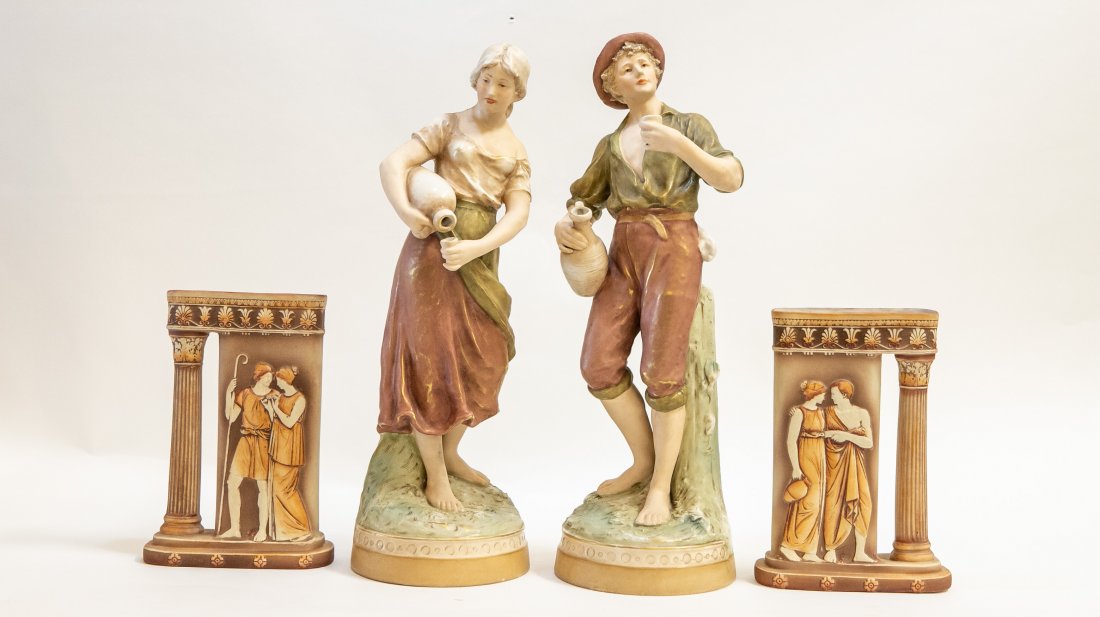 PAIR OF ROYAL DUX PORC FIGURES & PAIR OF VASES: The figures marked on the underside with raised pink triangular factory mark. Depicting a male and female peasant, the vases, unmarked, in the form of a classical ruin, decorated with a male and femal