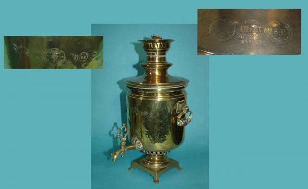 Russian Antique Brass Samovar, double-handled and: Russian Antique Brass Samovar, double-handled and footed. Measuring 8 inches in diameter by 19 ½ inches high. Some minor dents evident. The Samovar probably had a loop handle at one time. Sold as is.