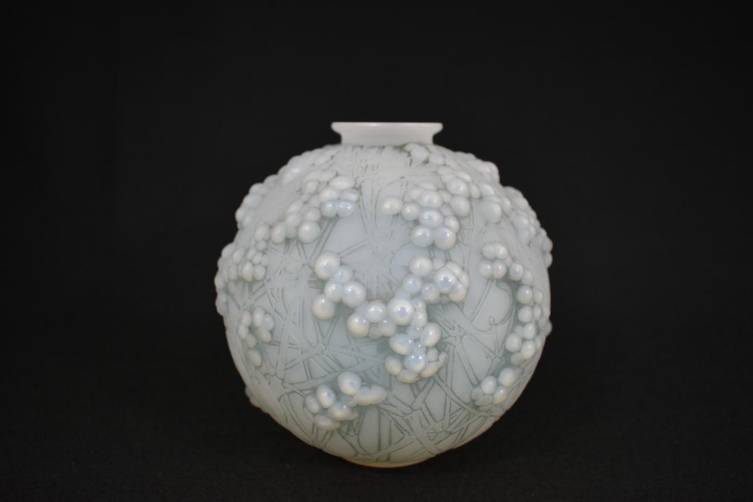 R. LALIQUE OPALESCENT DRUIDE VASE: Circa 1925. Signed in script R. Lalique France, etched numeral 268937. Introduced in 1924. The spherical vase with mistletoe berries and stylized crossed branches, highlighted with a blue patina. Heig