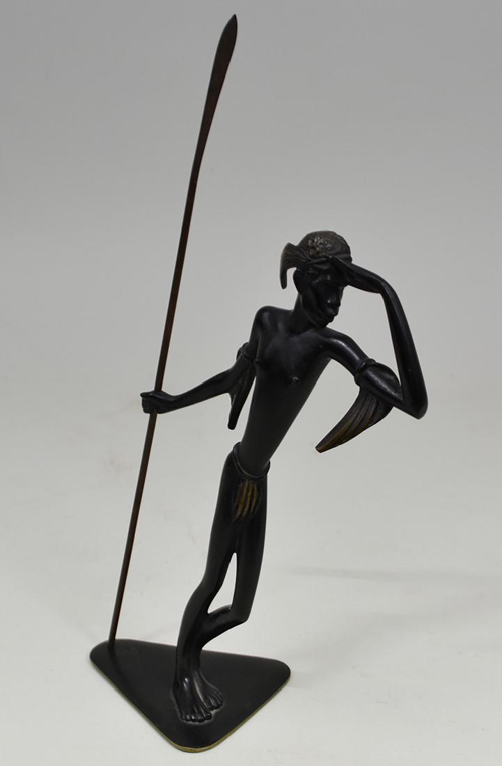 HAGENAUER RICHARD ROHAC PAT. BRONZE AFRICAN WARRIOR: Austrian, circa 1935. The standing figure with a spear gazing out towards the distance. Height of figure 9 in. (Cond: good) c.f. Richard Rohac apprenticed in the Hagenhauer, Wien workshop as a young m