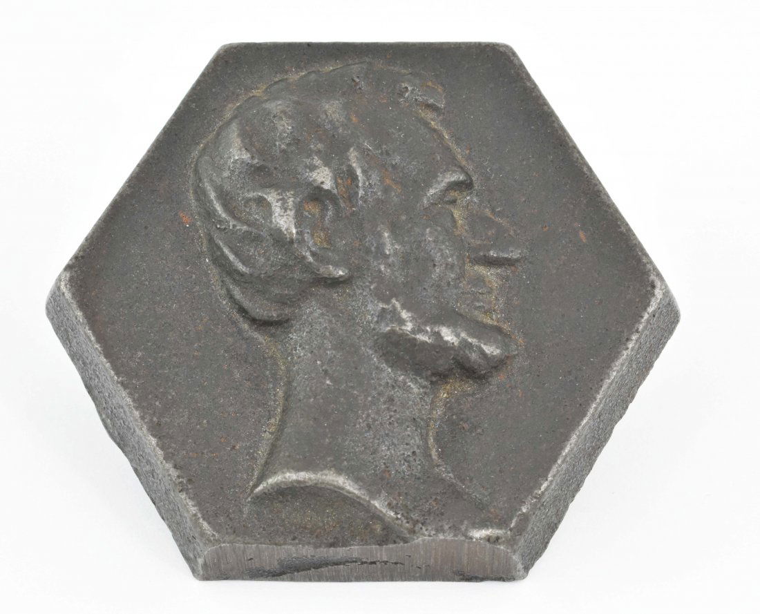 LINCOLN IN PROFILE HEXAGONAL METAL TILE MOLD: LINCOLN IN PROFILE HEXAGONAL METAL TILE MOLDCirca 1932. The reverse with the Mosaic Tile Company monogram. The profile used on the offered lot resembles and is presumably after Franklin W. Simmons (18