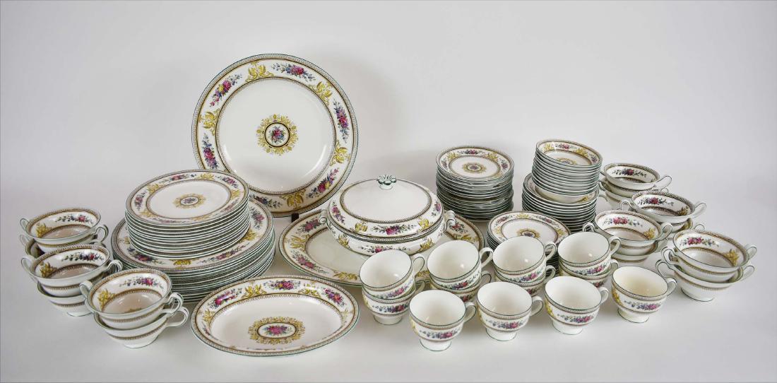 WEDGWOOD PORCELAIN 103 PIECE DINNER SERVICE: Circa 1920. The underside of each marked. In the Columbia Pattern. Decorated with two griffins centering a torch alternating with foliate garlands. Comprising: 12 dinner plates, 12 luncheon plates, 12